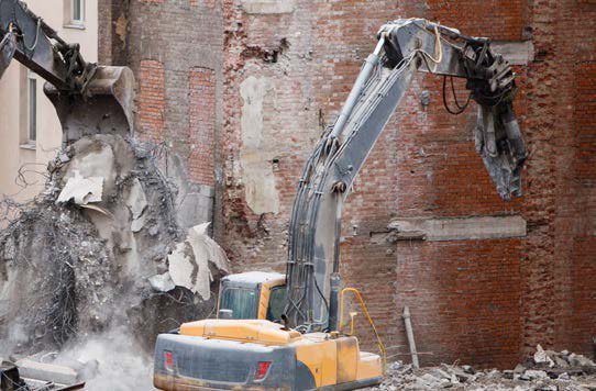 BYG crusher taking down a masonry structure