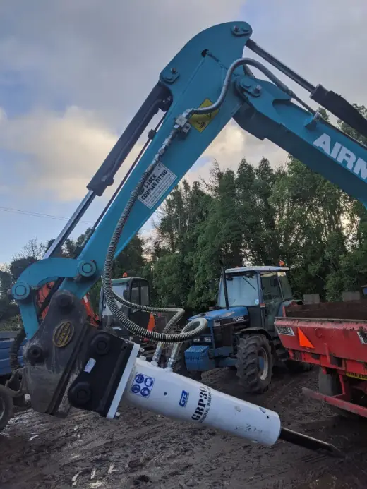 Hydraulic breaker on an excavator at a clearance job
