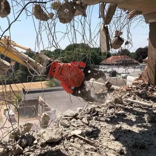 NPK concrete crusher working a demolition job
